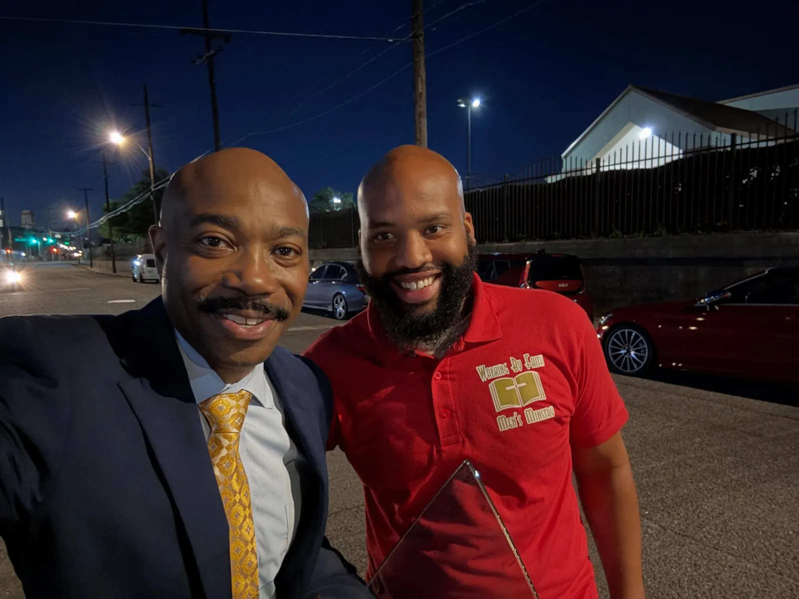 Pastor selfie with a Walking By Faith Men's Ministry member outside at night