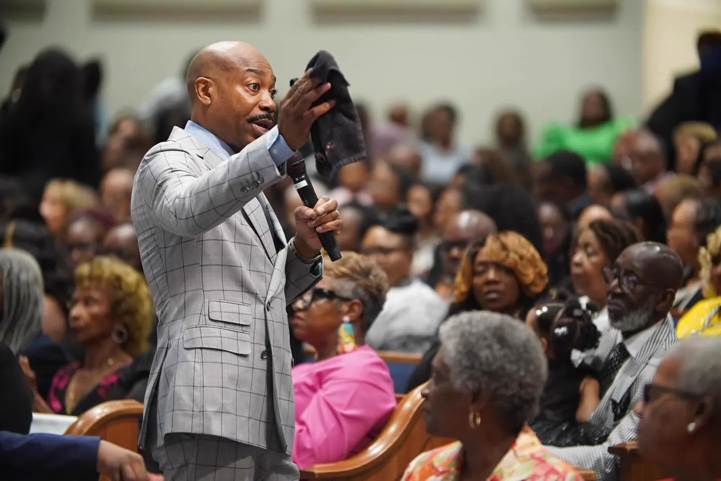 Pastor preaching among the congregation