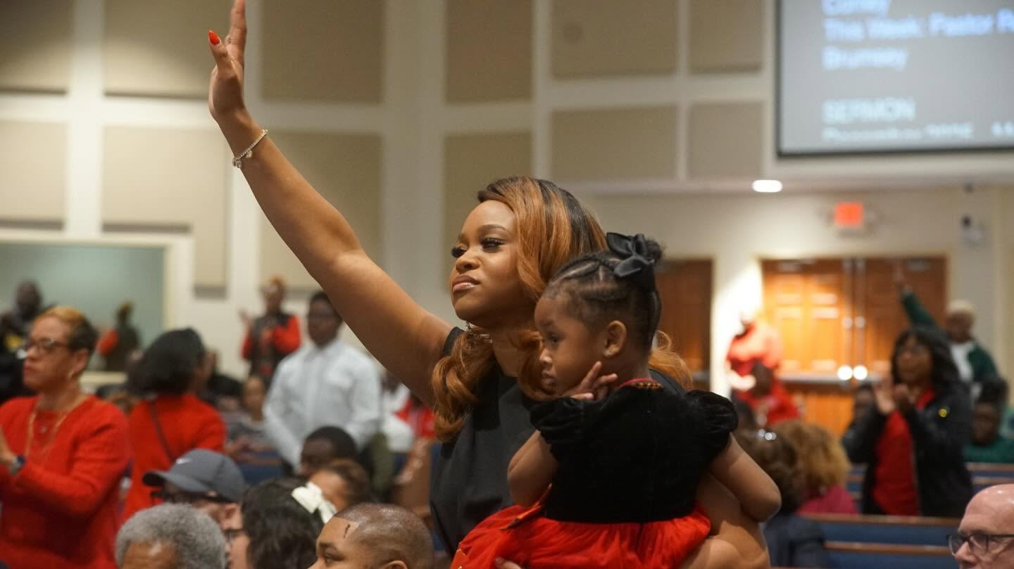 Brown Everywhere members praising together during service